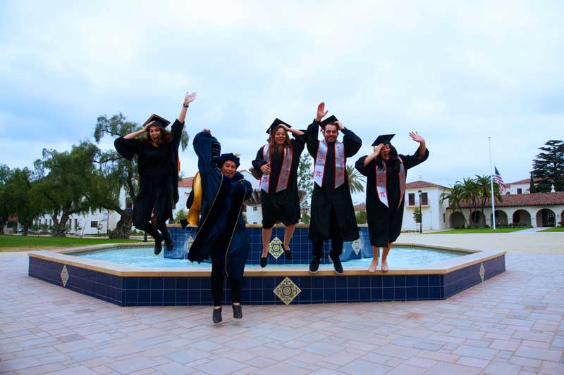 Graduates jumping off Central Mall fountain